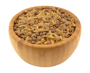 Side view of rice and lentils dry food mix in a wood bamboo bowl isolated on a white background.