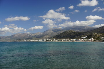 Fototapeta na wymiar over the Aegean Sea in Crete. Low hanging clouds. Mountains water horizon