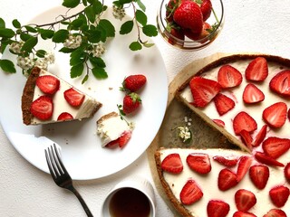 Strawberry cheescake. Delicious strawberry tart on a white wooden background, top view	