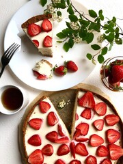 Strawberry cheescake. Delicious strawberry tart on a white wooden background, top view	