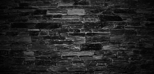 Dark black brick walls, brick room, interior texture, wall background.