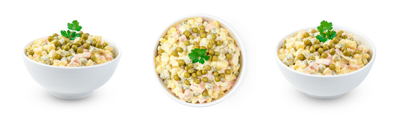 A set of traditional olivier salad with vegetables and fresh herbs in different angles is isolated on a white background.