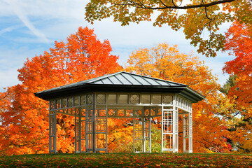 Pavilion at the institute Park of Worcester. MA with autumn foliage in background. The park is a public park in Worcester, MA. Founded on donated land in 1887, it is located next to the campus of WPI.