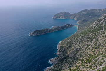Fototapeta na wymiar Aerial view of Marmaris ciftlik bay with beautiful colored sea top view