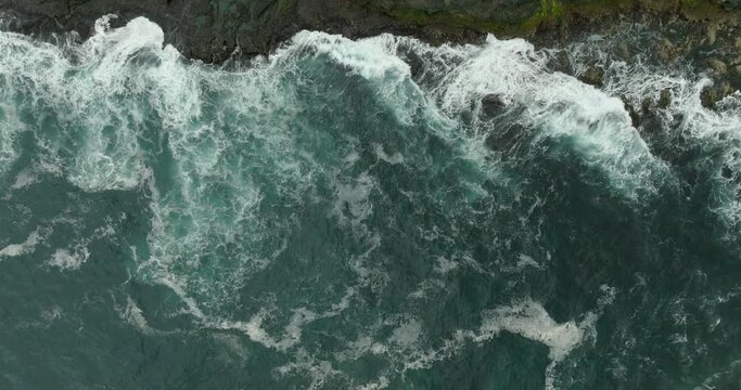 Aerial Top Forward Shot Of Sea Waves Splashing On Cliff - Faroe Islands, Denmark