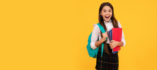 amazed kid going to do homework. teenager student hold planner notebook. Portrait of schoolgirl student, banner header. School child face isolated panorama background with copy space.