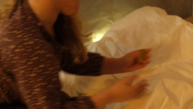 girl wakes up and sees magical light under pillow, coin from tooth fairy, magic for the baby, loss of young teeth