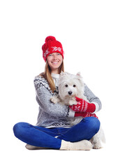 Obraz premium Full length picture of a woman in a white studio sitting with her dog