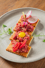 tapas with beef tartare and yolk