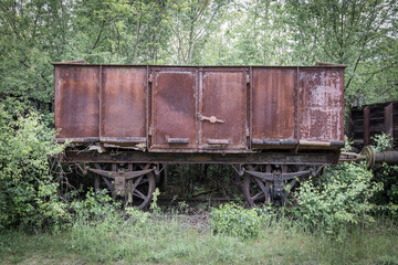 Fototapeta na wymiar Wagons and locomotives on a scrap yard for railway systems