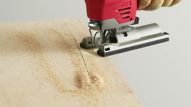 Jigsaw cutting wood in Slow motion