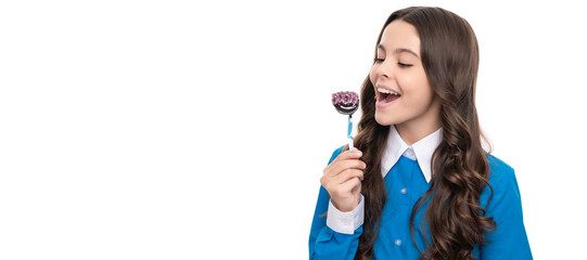 happy child long curly hair eat chocolate candy on stick isolated on white. Teenager child with sweets, poster banner header, copy space.