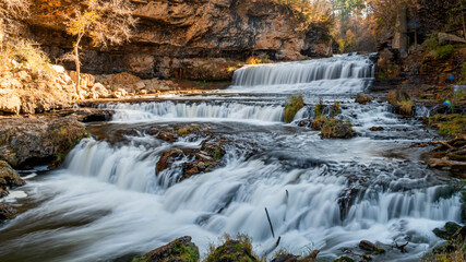 Waterfall at Willow River State Park in Hudson Wisconsin in fall - obrazy, fototapety, plakaty