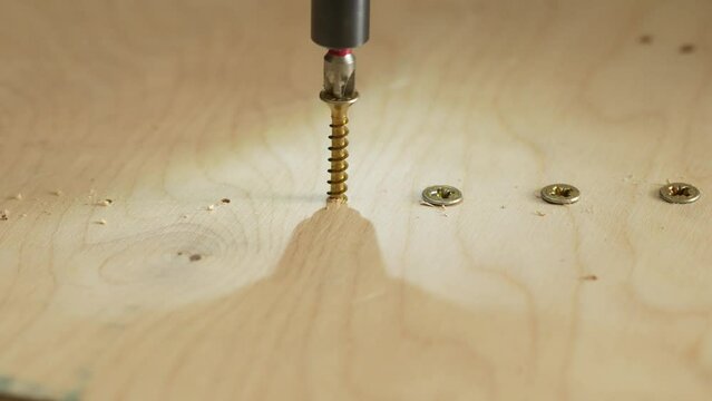 screwing wood in slow motion