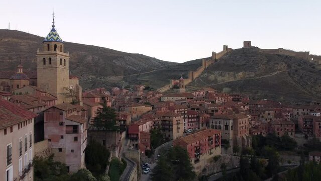 Views of Albarracin at sunset with its walls and the church of Santa Maria y Santiago.