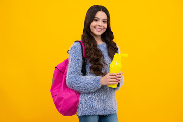 Back to school, student teenager girl with water bottle and holding books and note books wearing backpack. Happy teenager, positive and smiling emotions of teen schoolgirl.