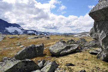 Sognefjell, Jotunheim, Norway - rocky landscape with snow in a natural park. Snow-covered rocks, mountains and icy lakes.