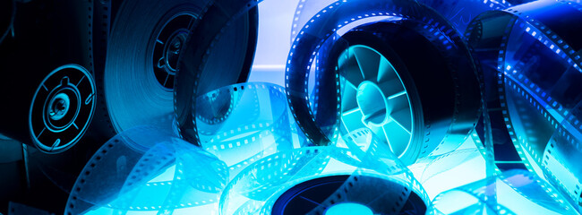 film strip and film roll on blue background isolated for desktop wallpaper banner.film production...