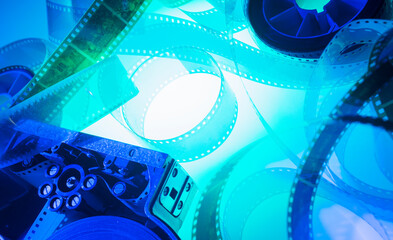 film strip and film roll on blue background isolated for desktop wallpaper banner.film production media festivals concept