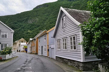 Fototapeta na wymiar Laerdalsoyri, Norway - Street with old wooden houses. A UNESCO historical monument in Norway.
