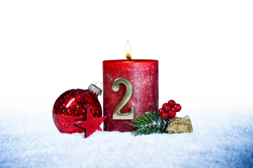second sunday of advent red candle with golden metal number two red decoration one on  snow isolated background