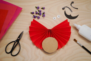Step by step diy process handmade craft Ladybug made of paper and flowers. Step 5- we glue a circle...