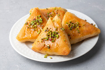 Traditional Turkish desserts; custard triangular dessert, albanian dessert ( Turkish name; Arnavut tatlisi or muhallebili muska tatlisi)
