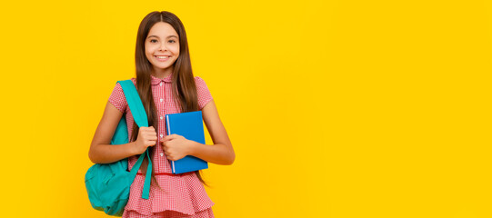 happy school kid carry backpack and workbook, knowledge day. Portrait of schoolgirl student, studio banner header. School child face, copyspace.