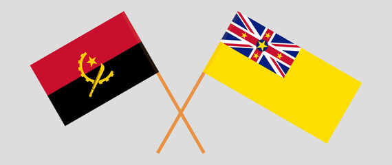 Crossed flags of Angola and Niue. Official colors. Correct proportion