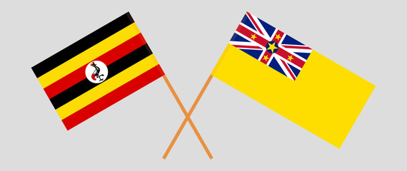 Crossed flags of Uganda and Niue. Official colors. Correct proportion