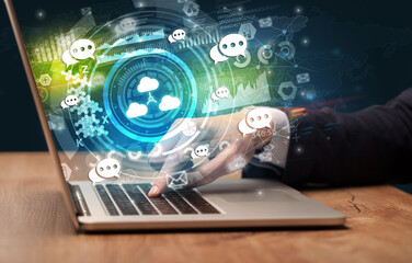 Business hand typing on a modern laptop