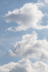 Blue sky background with white clouds.