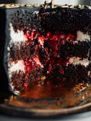 festive black chocolate cake with liquid cherry filling