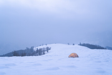Fototapeta na wymiar Winter camping with tent