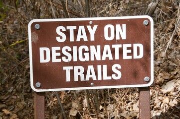 Stay on designated trails sign at beginning of trail head Corral canyon park Malibu California