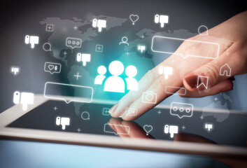Close-up of a hand using tablet, social media concept