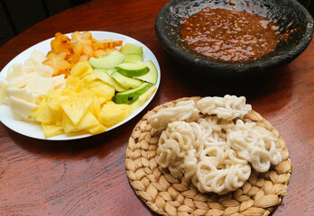 Lotis buah or rujak. fruits with hot chili paste and chips or kerupuk. indonesian traditional fruit salad