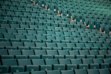 The empty seats of the stadium await match day