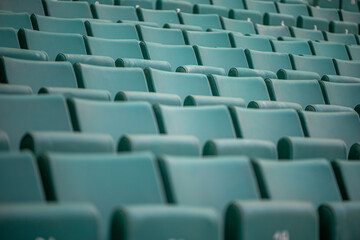 The empty seats of the stadium await match day