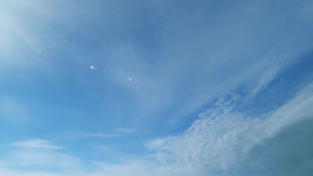 Beautiful white altostratus clouds in sky. Formed when large masses of warm, moist air rise. Timelapse.
