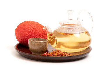 Gac and dried shell used to make tea isolated on white background.