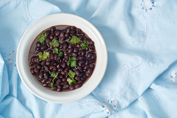Black bean soup in a bowl, traditional mexican and latin american food.