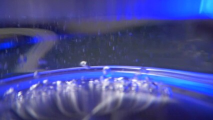 The moment of boiling hot water in an electric kettle, the bubbles come off the bottom and rise up. Teapot. Boiling point.