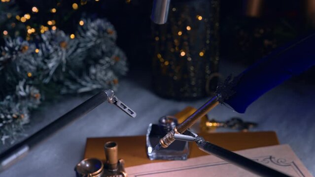Writing with the help of robotic arms of surgical equipment. Da Vinci robot holding writing pen. Christmas garlands and lights at backdrop.