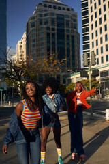 Portrait of young friend group together in the city on rollerskates
