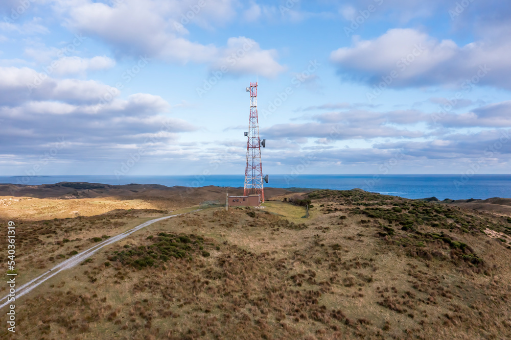 Wall mural drone aerial photograph of a communications tower on king island