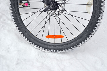 Fototapeta premium Part of bicycle wheel with studded tire