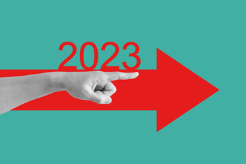 New Year concepts, Hand pointing finger, with red arrow and new year 2023