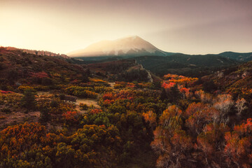 Sun rise glows on the mountain in the fall