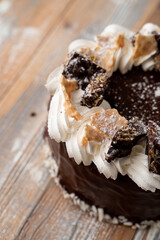 Soviet cake with buttercream swirls with chocolate crumpets, top view photography for a coffee shop menu